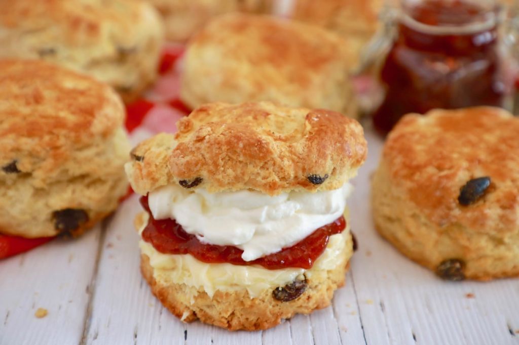 Best-Ever Irish Scones filled with cream and jam amongst other scones.