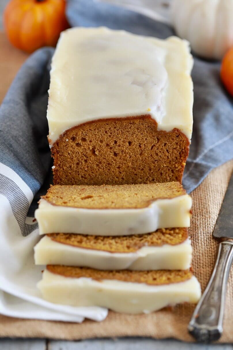 The BestEver Pumpkin Bread is incredibly moist and packed with spices and flavors, topped with fabulous brown butter and maple glaze. It's sliced and ready to be enjoyed.